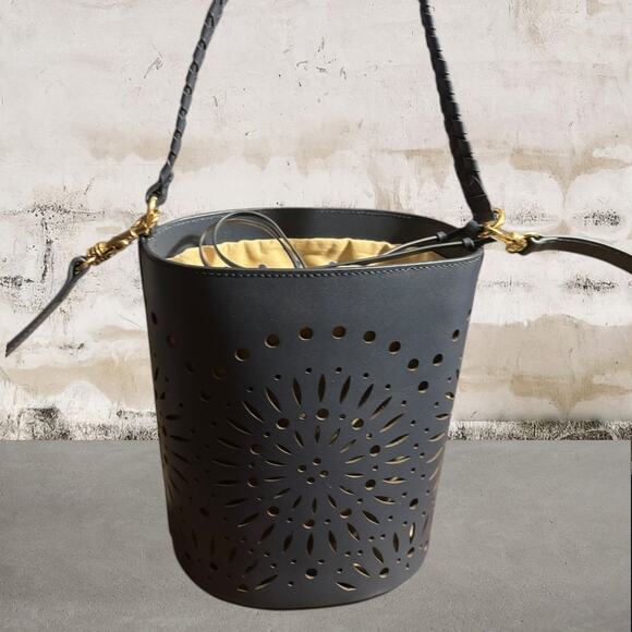 Chico's Handbags - Chico's Navy Laser-Cut Bucket Crossbody with Tan Liner